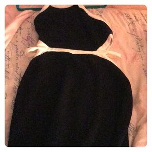 Black dress with white outlining and cut out sides